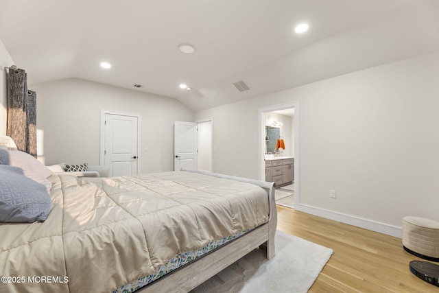 bedroom featuring lofted ceiling, recessed lighting, light wood-style floors, and visible vents