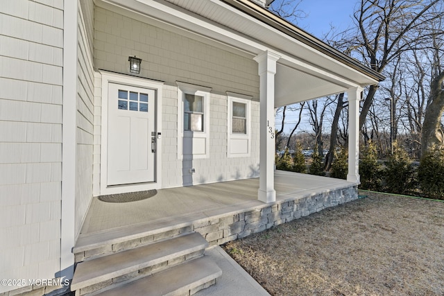 property entrance with covered porch