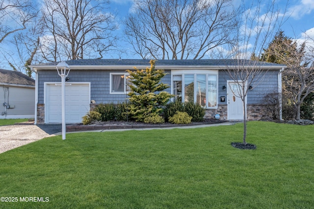 ranch-style house with stone siding, driveway, an attached garage, and a front yard