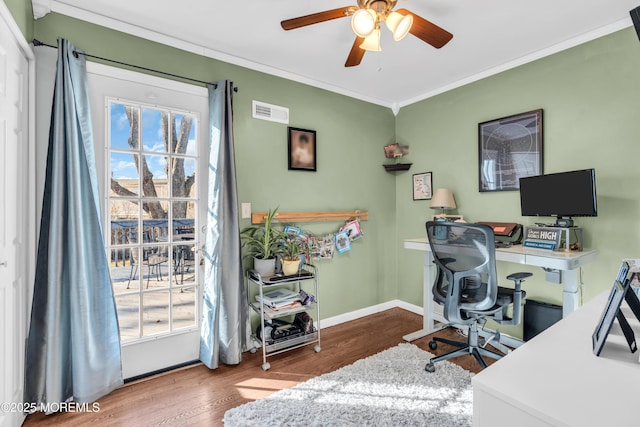 office area with wood finished floors, visible vents, baseboards, ceiling fan, and crown molding