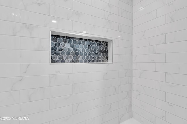 details with a tile shower