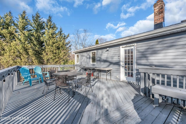 deck with outdoor dining area