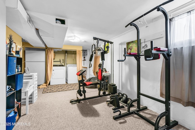 workout area featuring carpet and washing machine and dryer