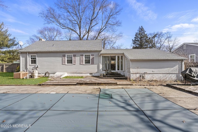 view of front of property with entry steps, a covered pool, fence, roof with shingles, and a patio area