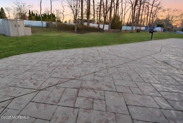 patio terrace at dusk with a lawn