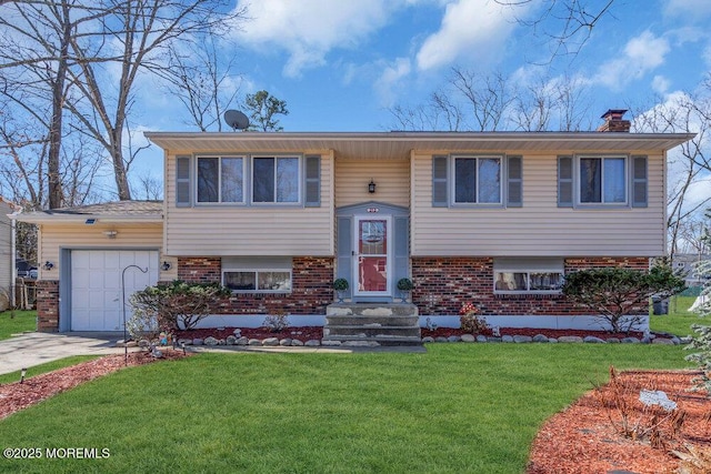 bi-level home featuring a front yard, brick siding, an attached garage, and a chimney