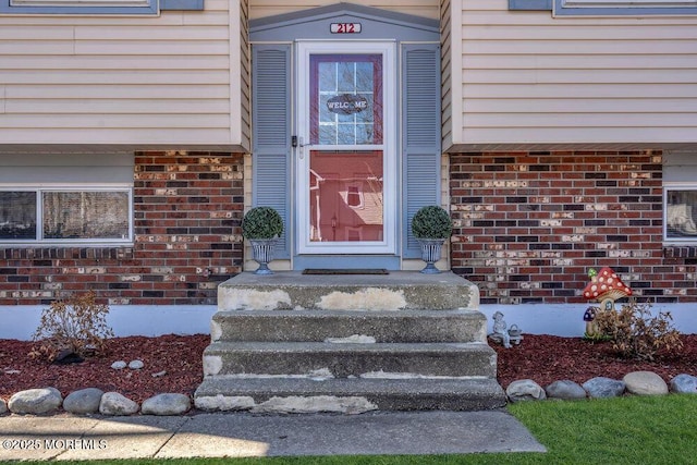 entrance to property with brick siding