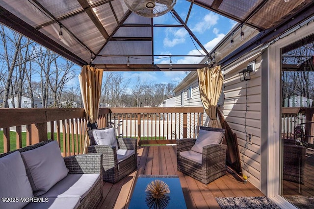 wooden deck featuring an outdoor hangout area