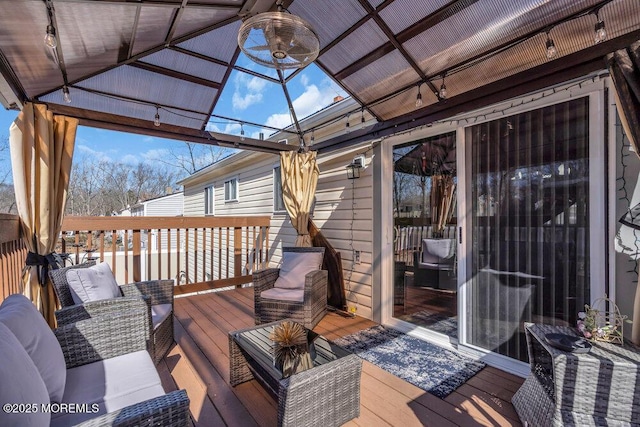 wooden deck featuring an outdoor hangout area