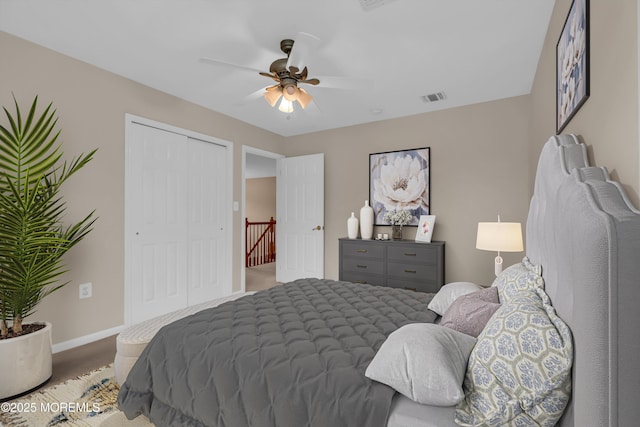 bedroom featuring visible vents, baseboards, a closet, and a ceiling fan