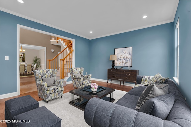 living room with stairway, wood finished floors, and ornamental molding