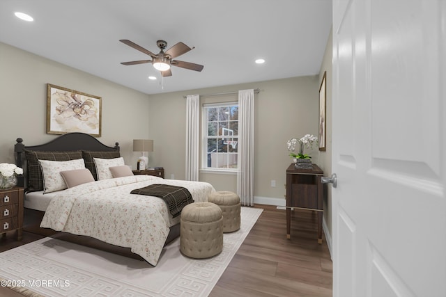 bedroom with recessed lighting, wood finished floors, baseboards, and ceiling fan