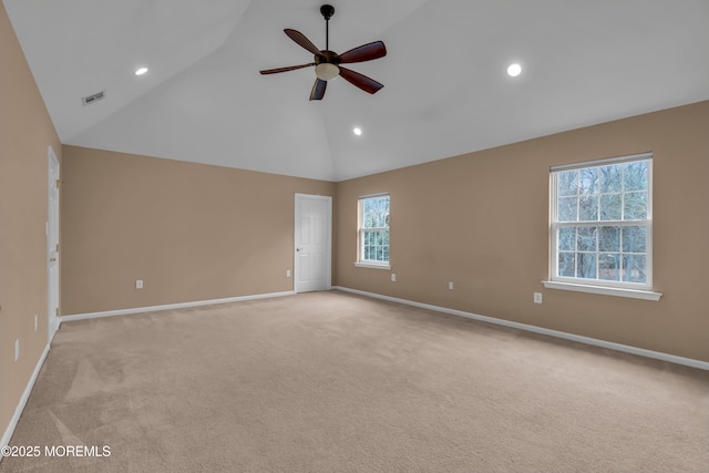 spare room featuring baseboards, high vaulted ceiling, recessed lighting, ceiling fan, and light carpet