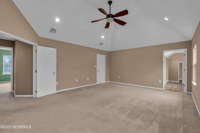 spare room with visible vents, light carpet, high vaulted ceiling, baseboards, and ceiling fan