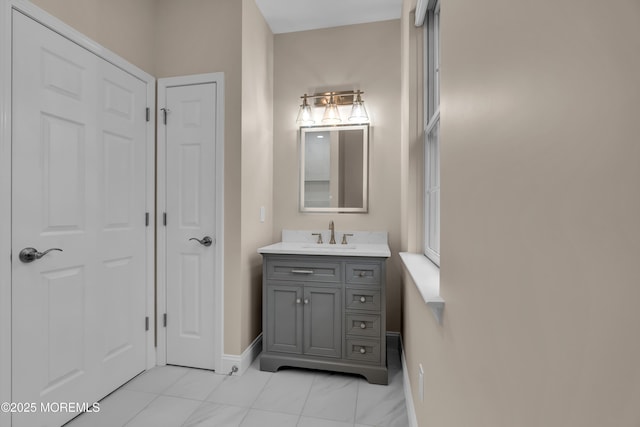 bathroom featuring vanity and baseboards