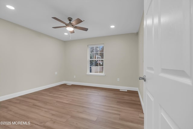 empty room featuring recessed lighting, baseboards, light wood finished floors, and ceiling fan