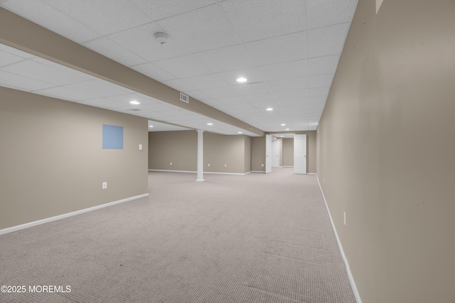 finished basement with visible vents, recessed lighting, carpet, a paneled ceiling, and baseboards