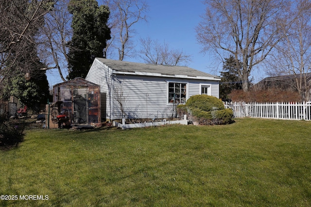 view of outbuilding featuring an outbuilding and fence