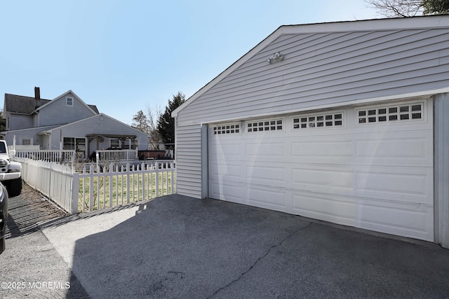 garage with fence