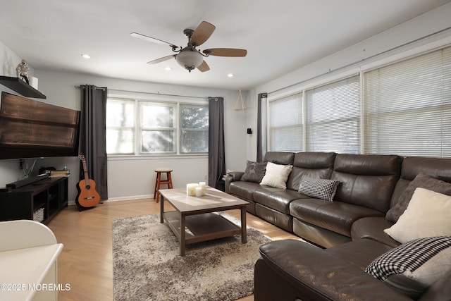 living area featuring recessed lighting, baseboards, light wood-type flooring, and ceiling fan