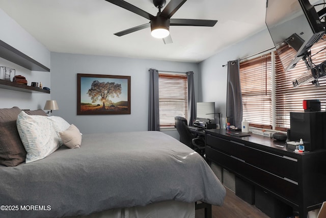 bedroom with a ceiling fan and wood finished floors