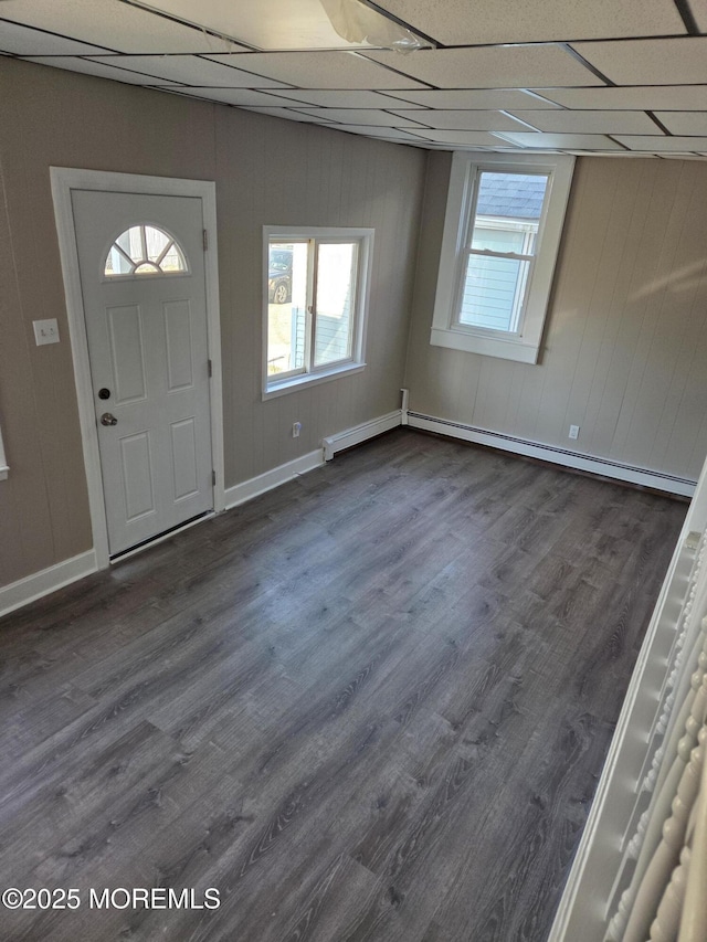 foyer entrance featuring a paneled ceiling, dark wood-style floors, baseboards, and a baseboard radiator