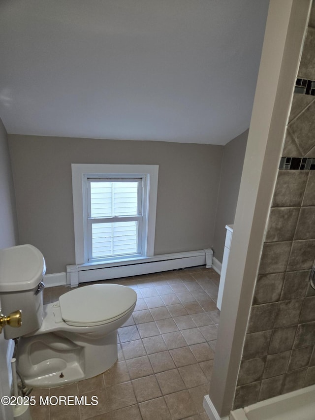 bathroom with baseboards, a baseboard radiator, a tile shower, tile patterned floors, and toilet