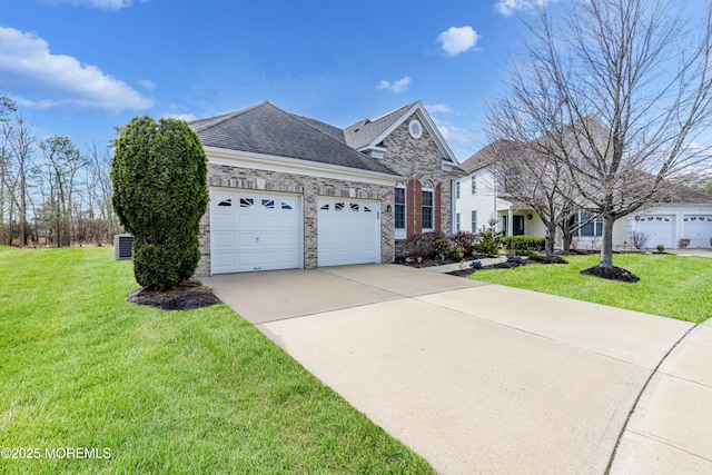 view of front of property featuring brick siding, a front yard, roof with shingles, driveway, and an attached garage