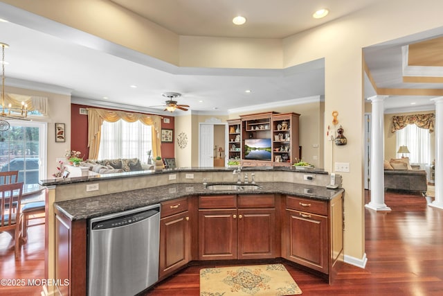 kitchen featuring a sink, stainless steel dishwasher, open floor plan, decorative columns, and dark wood-style flooring