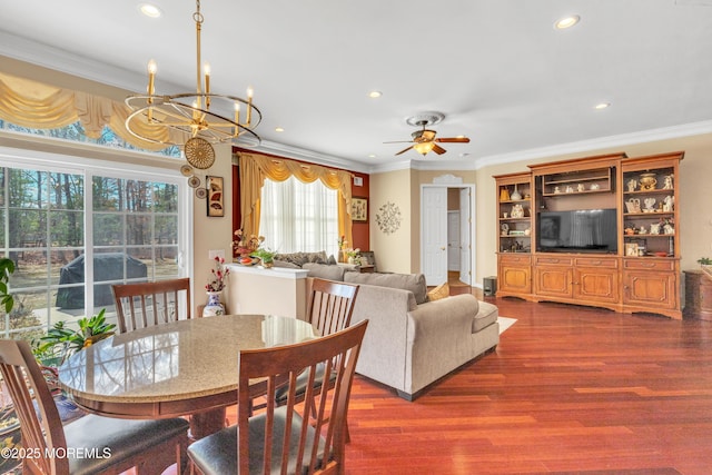 dining area featuring dark wood finished floors, recessed lighting, and ornamental molding