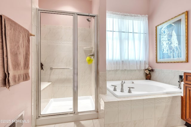 full bathroom featuring a shower stall and a garden tub