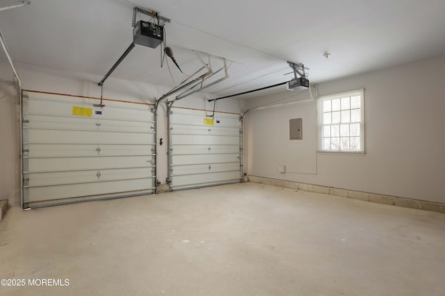 garage featuring electric panel and a garage door opener