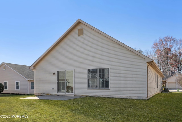 rear view of house featuring a patio area, central air condition unit, and a lawn