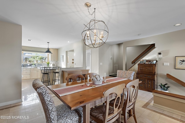 dining area with recessed lighting, baseboards, a chandelier, and light tile patterned floors