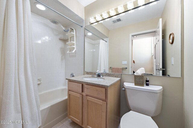 bathroom featuring vanity, toilet, visible vents, and shower / tub combo with curtain