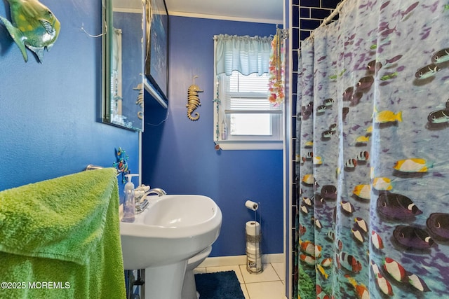 bathroom featuring tile patterned flooring, baseboards, and a shower with curtain