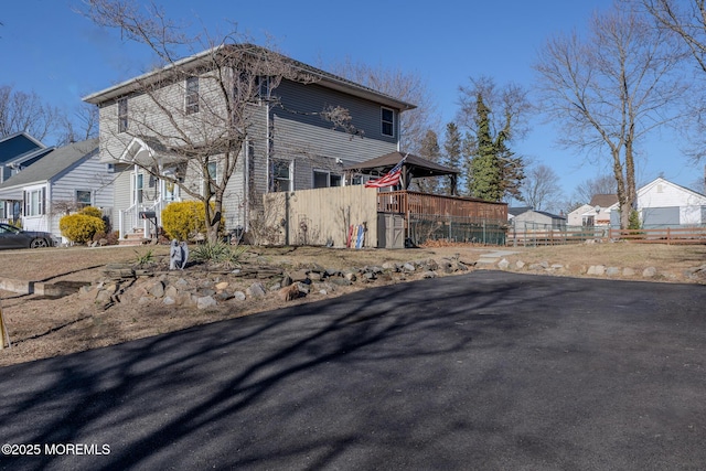 view of home's exterior with fence