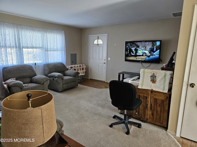 living room with visible vents and carpet