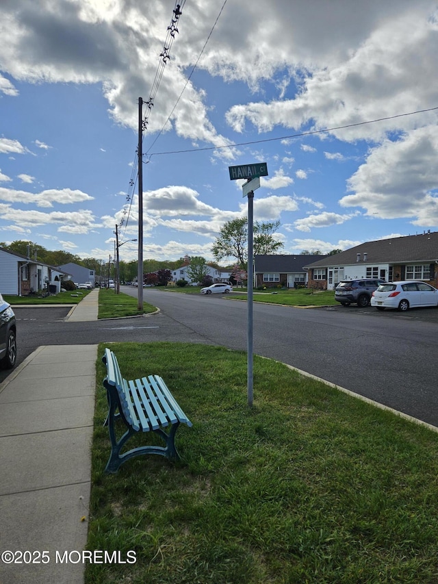 view of street featuring sidewalks and a residential view