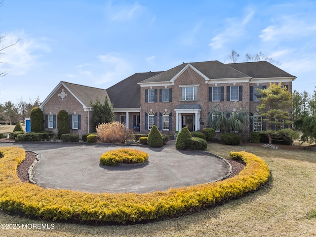 view of front of home featuring brick siding