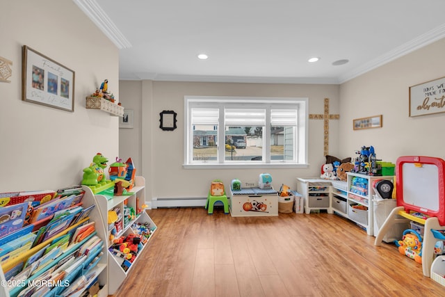 playroom with recessed lighting, baseboard heating, wood finished floors, and crown molding