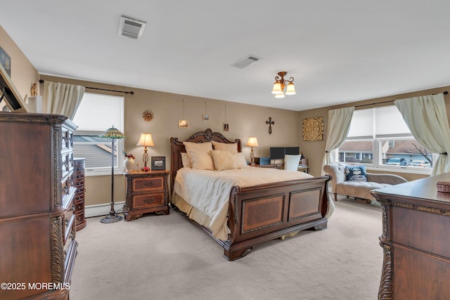 bedroom with visible vents, multiple windows, and light colored carpet