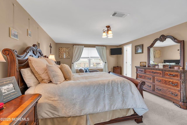 bedroom featuring carpet flooring and visible vents