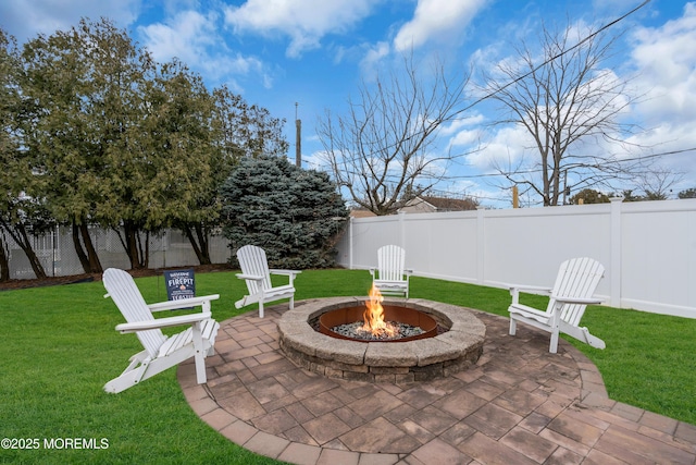 view of patio / terrace featuring a fire pit and a fenced backyard