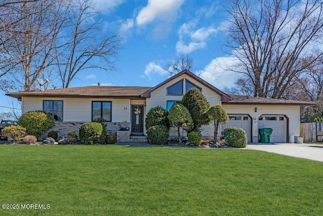 ranch-style home featuring a front lawn, concrete driveway, and an attached garage