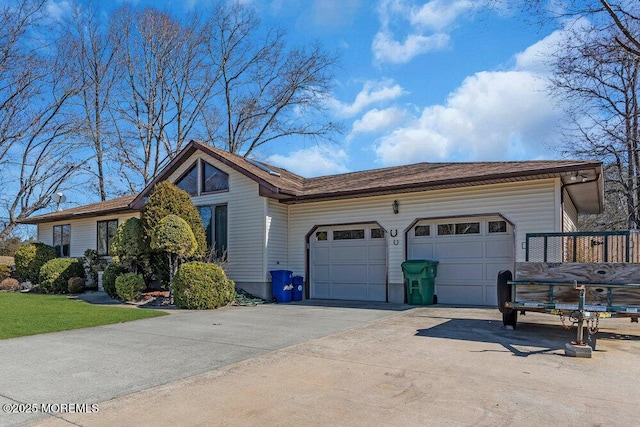 view of home's exterior featuring a garage and concrete driveway