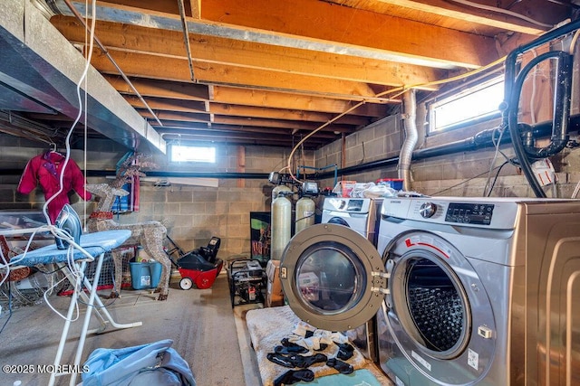 below grade area with washing machine and clothes dryer