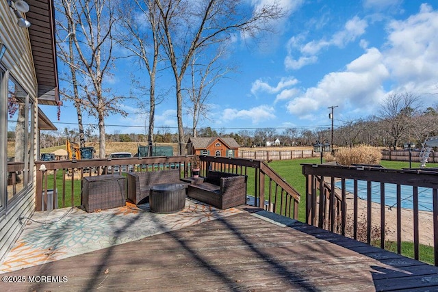 deck with a yard, an outdoor hangout area, and fence