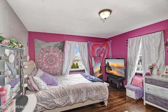 bedroom featuring wood finished floors