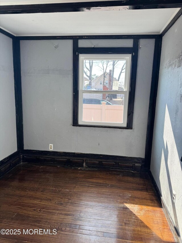 spare room with hardwood / wood-style flooring